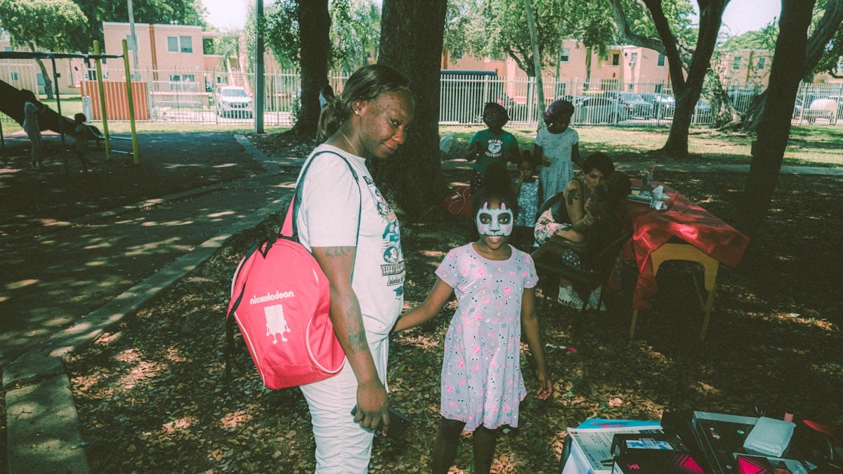 a man and a little girl standing next to each other